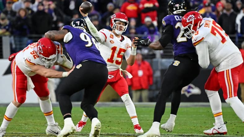 Jan 28, 2024; Baltimore, Maryland, USA; Kansas City Chiefs quarterback Patrick Mahomes (15) passes the ball against the Baltimore Ravens during the second half in the AFC Championship football game at M&T Bank Stadium. Mandatory Credit: Tommy Gilligan-USA TODAY Sports