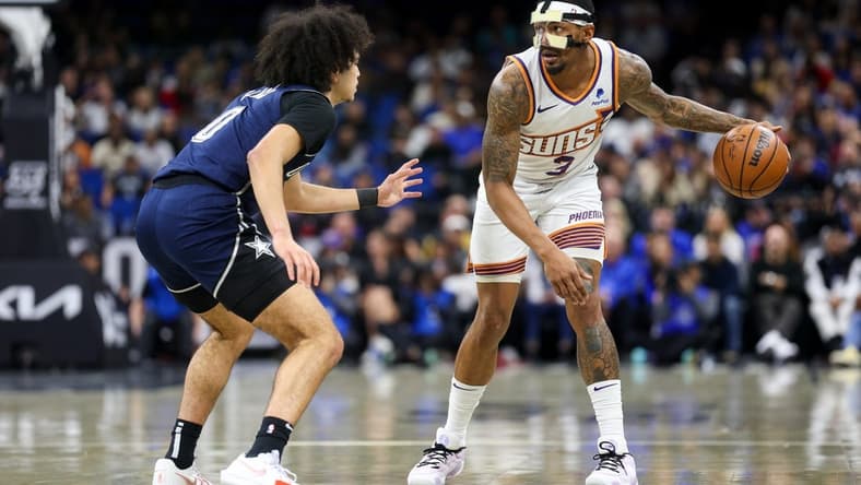 Jan 28, 2024; Orlando, Florida, USA; Phoenix Suns guard Bradley Beal (3) controls the ball from Orlando Magic guard Anthony Black (0) in the second quarter at the Kia Center. Mandatory Credit: Nathan Ray Seebeck-USA TODAY Sports