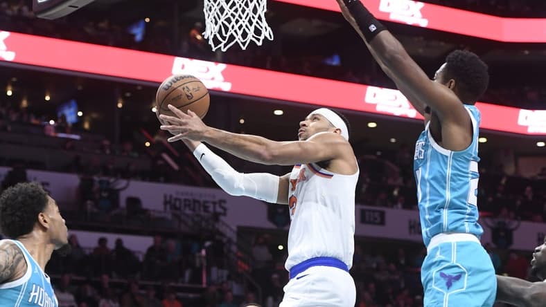 Jan 29, 2024; Charlotte, North Carolina, USA; New York Knicks guard Josh Hart (3) moves in past Charlotte Hornets forward guard Brandon Miller (24) during the first half at the Spectrum Center. Mandatory Credit: Sam Sharpe-USA TODAY Sports