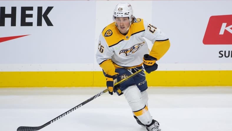 Jan 29, 2024; Ottawa, Ontario, CAN; Nashville Predators center Philip Tomasino (26) controls the puck in the third period against the Ottawa Senators at the Canadian Tire Centre. Mandatory Credit: Marc DesRosiers-USA TODAY Sports
