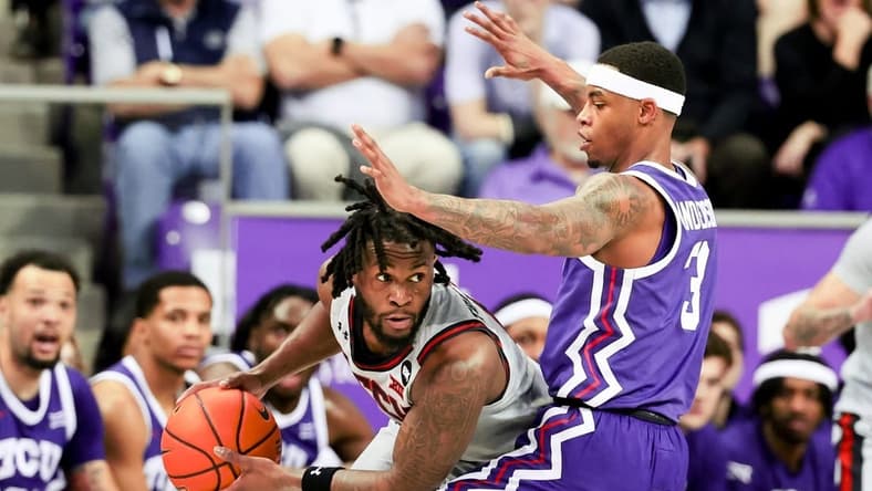 Jan 30, 2024; Fort Worth, Texas, USA; Texas Tech Red Raiders guard Joe Toussaint (6) looks to pass as TCU Horned Frogs guard Avery Anderson III (3) defends during the first half at Ed and Rae Schollmaier Arena. Mandatory Credit: Kevin Jairaj-USA TODAY Sports