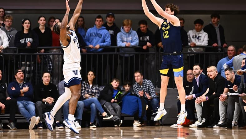 Jan 30, 2024; Villanova, Pennsylvania, USA; Marquette Golden Eagles forward Ben Gold (12) shoots against Villanova Wildcats forward Eric Dixon (43) in the first half at William B. Finneran Pavilion. Mandatory Credit: Kyle Ross-USA TODAY Sports