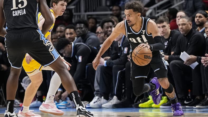Jan 30, 2024; Atlanta, Georgia, USA; Atlanta Hawks guard Trae Young (11) dribbles against the Los Angeles Lakers during the first half at State Farm Arena. Mandatory Credit: Dale Zanine-USA TODAY Sports