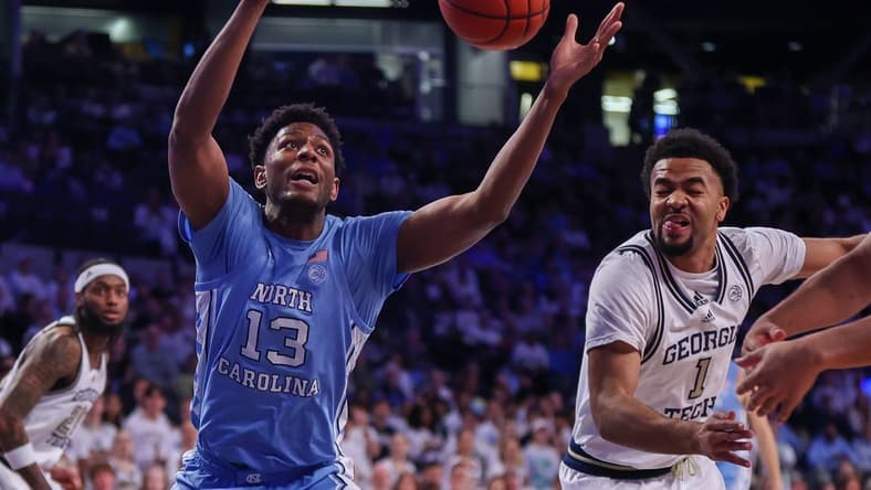 Jan 30, 2024; Atlanta, Georgia, USA; North Carolina Tar Heels forward Jalen Washington (13) and Georgia Tech Yellow Jackets guard Kyle Sturdivant (1) reach for a rebound in the first half at McCamish Pavilion. Mandatory Credit: Brett Davis-USA TODAY Sports