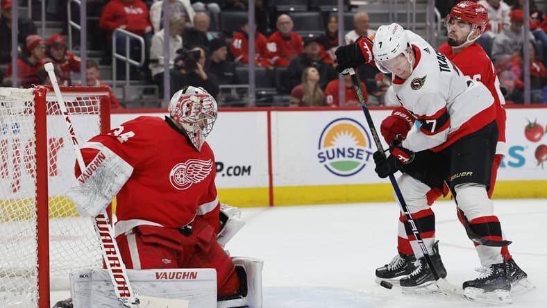Jan 31, 2024; Detroit, Michigan, USA; Ottawa Senators left wing Brady Tkachuk (7) tries to score on Detroit Red Wings goaltender Alex Lyon (34) in the first period at Little Caesars Arena. Mandatory Credit: Rick Osentoski-USA TODAY Sports