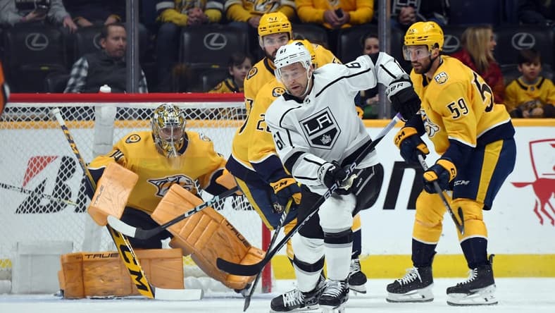 Jan 31, 2024; Nashville, Tennessee, USA; Los Angeles Kings center Trevor Lewis (61) chases down a loose puck during the first period against the Nashville Predators at Bridgestone Arena. Mandatory Credit: Christopher Hanewinckel-USA TODAY Sports