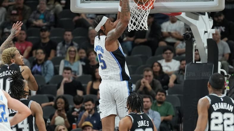 Jan 31, 2024; San Antonio, Texas, USA; Orlando Magic forward Paolo Banchero (5) dunks in the first half against the San Antonio Spurs at Frost Bank Center. Mandatory Credit: Daniel Dunn-USA TODAY Sports