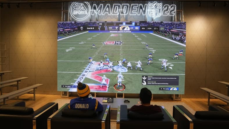 Feb 9, 2022; Los Angeles, CA, USA; People play EA Sports Madden 22 video game at the Nike store at the Grove. Mandatory Credit: Kirby Lee-USA TODAY Sports
