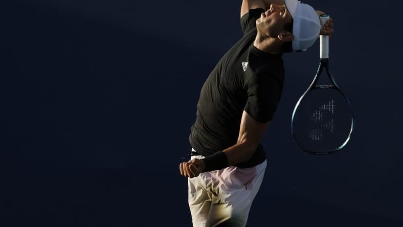 Mar 23, 2022; Miami Gardens, FL, USA; Jaume Munar (ESP) serves against Taro Daniel (JPN) (not pictured) in a first round men's singles match in the Miami Open at Hard Rock Stadium. Mandatory Credit: Geoff Burke-USA TODAY Sports