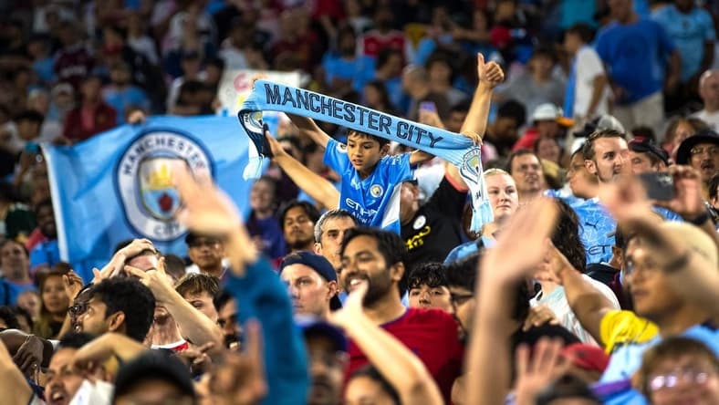 A young fan holds a "Manchester City" scarf after the exhibition match between FC Bayern Munich and Manchester City on Saturday, July 23, 2022, at Lambeau Field in Green Bay, Wis.
Gpg Bayern Man City Match 7232022 0004