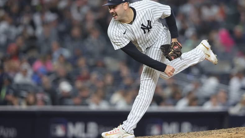 Oct 22, 2022; Bronx, New York, USA; New York Yankees relief pitcher Lou Trivino (56) pitches in the seventh inning against the Houston Astros during game three of the ALCS for the 2022 MLB Playoffs at Yankee Stadium. Mandatory Credit: Brad Penner-USA TODAY Sports