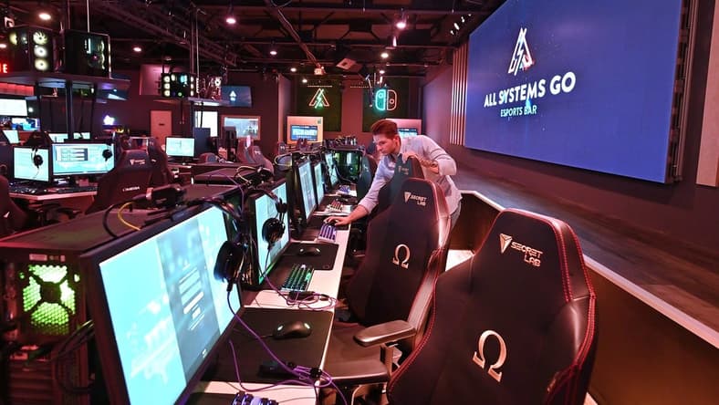 WORCESTER - Devin LaPlume sets up computers in front of a stage and big screen monitor at All Systems Go Esports Bar which is now All Systems Go Esports Facility and is working to grow the esports scene in local colleges and high schools.
Loc Asgexpansion5 0105