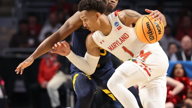 Mar 16, 2023; Birmingham, AL, USA; Maryland Terrapins guard Jahmir Young (1) dribbles against West Virginia Mountaineers guard Joe Toussaint (5) during the second half in the first round of the 2023 NCAA Tournament at Legacy Arena. Mandatory Credit: Vasha Hunt-USA TODAY Sports