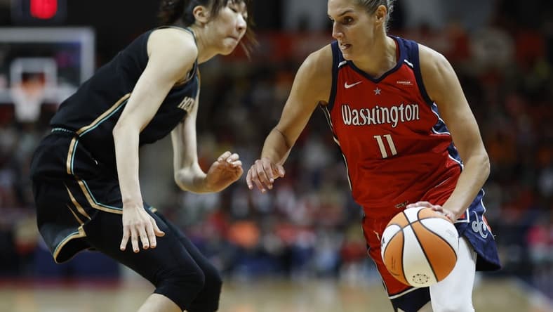 May 19, 2023; Washington, District of Columbia, USA; Washington Mystics forward Elena Delle Donne (11) drives to the basket as New York Liberty center Han Xu (21) defends in the fourth quarter at Entertainment & Sports Arena. Mandatory Credit: Geoff Burke-USA TODAY Sports