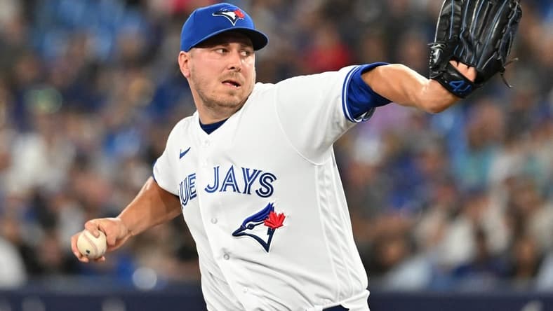 Jun 23, 2023; Toronto, Ontario, CAN; Toronto Blue Jays relief pitcher Erik Swanson (50) delivers a pitch against the Oakland Athletics in the eighth inning at Rogers Centre. Mandatory Credit: Dan Hamilton-USA TODAY Sports