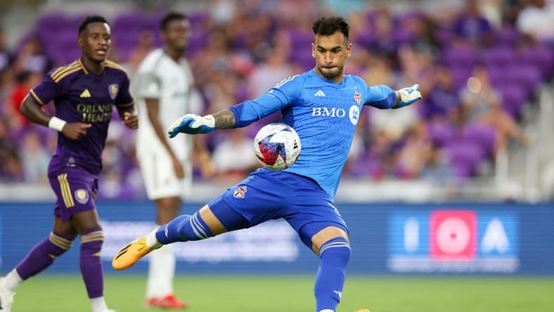 Jul 4, 2023; Orlando, Florida, USA; Toronto FC goalkeeper Greg Ranjitsingh (18) puts the ball in play against Orlando City SC in the first half at Exploria Stadium. Mandatory Credit: Nathan Ray Seebeck-USA TODAY Sports