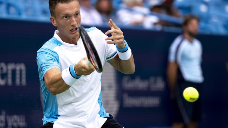 Aug 15, 2023; Mason, OH, USA; Jiri Lehecka, of Czech Republic, hits a return to Taylor Fritz, of the United States, during the Western & Southern Open at Lindner Family Tennis Center. Mandatory Credit: Albert Cesare-USA TODAY Sports