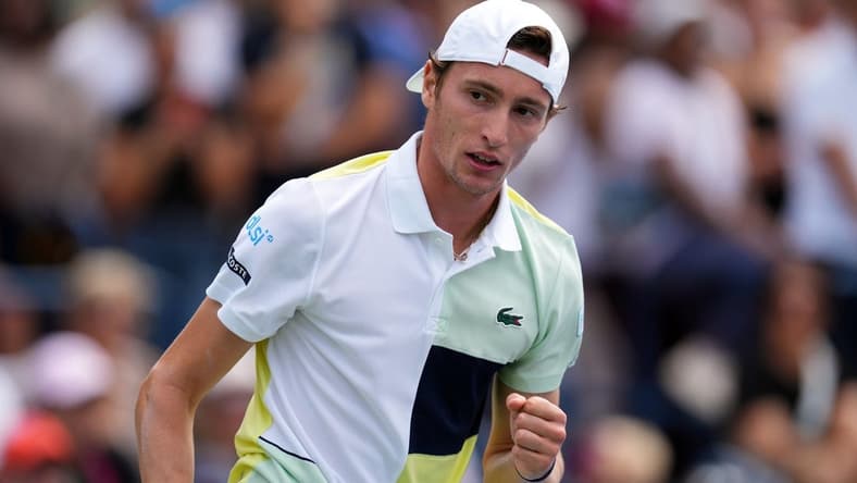Aug 29, 2023; Flushing, NY, USA; Ugo Humbert of France wins a game in the first set against Matteo Berrettini of Italy on day two of the 2023 U.S. Open tennis tournament at USTA Billie Jean King National Tennis Center. Mandatory Credit: Danielle Parhizkaran-USA TODAY Sports