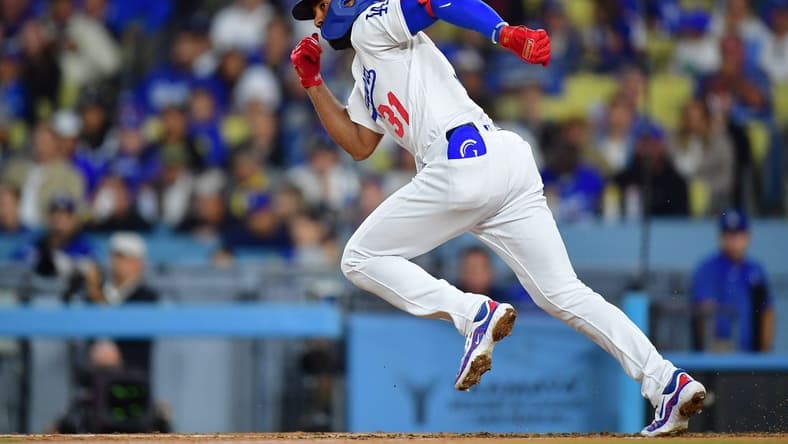 Sep 21, 2023; Los Angeles, California, USA; Los Angeles Dodgers second baseman Amed Rosario (31) runs after hitting a single against the San Francisco Giants during the fourth inning at Dodger Stadium. Mandatory Credit: Gary A. Vasquez-USA TODAY Sports