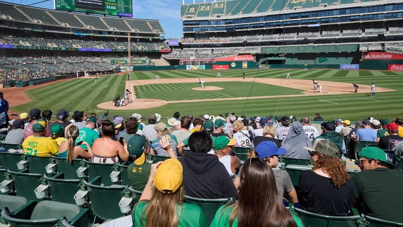 Sep 24, 2023; Oakland, California, USA; Fans watch Detroit Tigers designated hitter Miguel Cabrera (24) swing at a pitch against Oakland Athletics starting pitcher JP Sears (38) during the fifth inning at Oakland-Alameda County Coliseum. Mandatory Credit: Robert Edwards-USA TODAY Sports