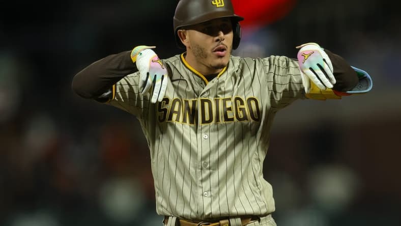 Sep 25, 2023; San Francisco, California, USA; San Diego Padres third baseman Manny Machado (13) celebrates after a single during the ninth inning against the San Francisco Giants at Oracle Park. Mandatory Credit: Sergio Estrada-USA TODAY Sports