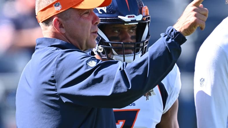 Oct 1, 2023; Chicago, Illinois, USA; Denver Broncos head coach Sean Payton talks with quarterback Russell Wilson (3) before a game against the Chicago Bears at Soldier Field. Mandatory Credit: Jamie Sabau-USA TODAY Sports