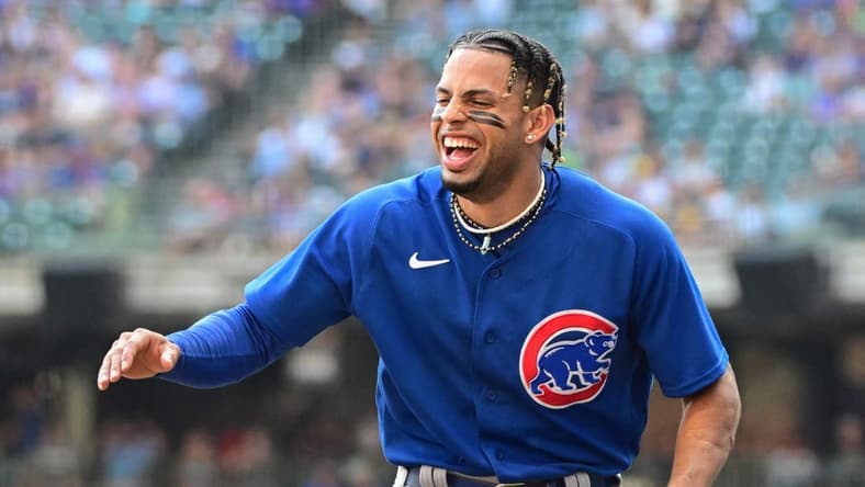 Oct 1, 2023; Milwaukee, Wisconsin, USA; Chicago Cubs shortstop Christopher Morel (5) jokes with teammates between innings against the Milwaukee Brewers at American Family Field. Mandatory Credit: Benny Sieu-USA TODAY Sports