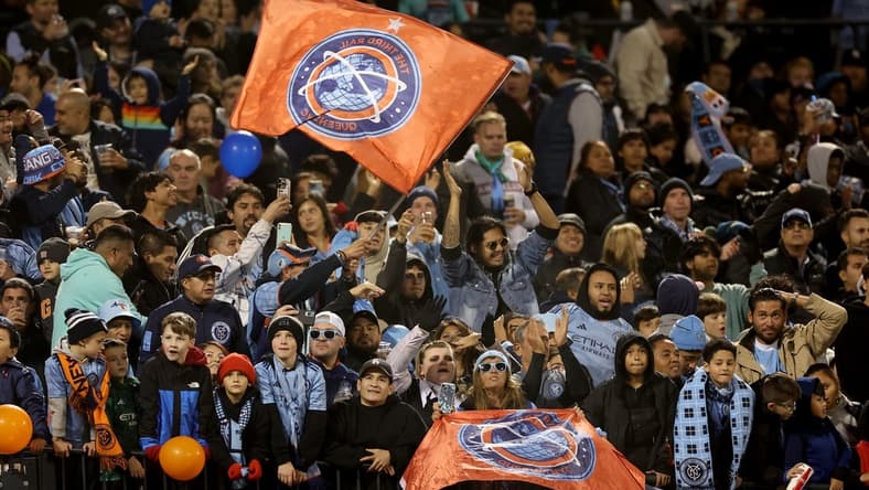 Oct 21, 2023; New York, NY, New York, NY, USA; New York City FC fans celebrate after a goal by forward Julian Fernandez (not pictured) during the second half against the Chicago Fire at Citi Field. Mandatory Credit: Vincent Carchietta-USA TODAY Sports