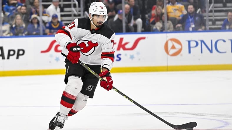 Nov 3, 2023; St. Louis, Missouri, USA; New Jersey Devils defenseman Jonas Siegenthaler (71) controls the puck against the St. Louis Blues during the first period at Enterprise Center. Mandatory Credit: Jeff Curry-USA TODAY Sports