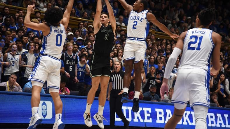 Nov 6, 2023; Durham, North Carolina, USA; Duke Blue Devils guard Jaylen Blakes (2) blocks the shot of Dartmouth Big Green forward Dusan Neskovic (3) during the first half at Cameron Indoor Stadium. Mandatory Credit: Rob Kinnan-USA TODAY Sports