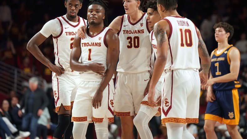 Nov 14, 2023; Los Angeles, California, USA; Southern California Trojans forward Joshua Morgan (24), guard Isaiah Collier (1), forward Harrison Hornery (30), guard Oziyah Sellers (4) and forward DJ Rodman (10) react in the second half against the UC Irvine Anteaters at Galen Center. Mandatory Credit: Kirby Lee-USA TODAY Sports