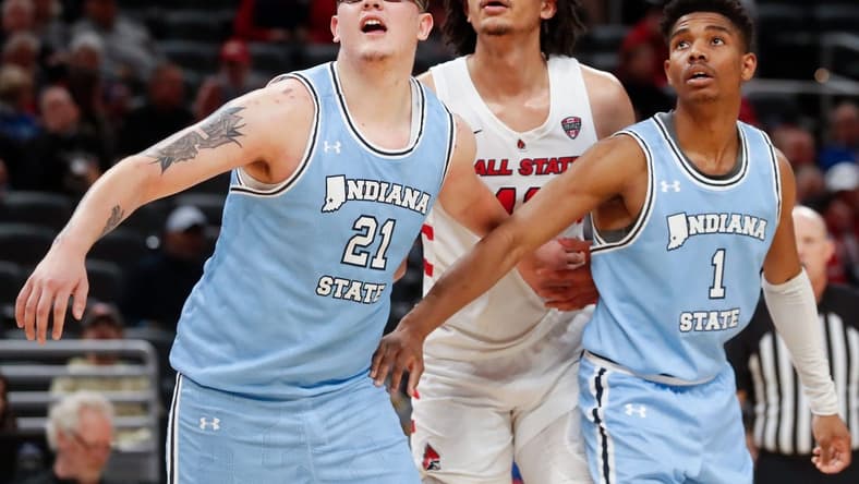 Indiana State Sycamores center Robbie Avila (21) and Indiana State Sycamores guard Julian Larry (1) box out Ball State Cardinals forward Basheer Jihad (11) during the NCAA men s basketball game, Saturday, Dec. 16, 2023, at Gainbridge Fieldhouse in Indianapolis. Indiana State Sycamores won 83-72.