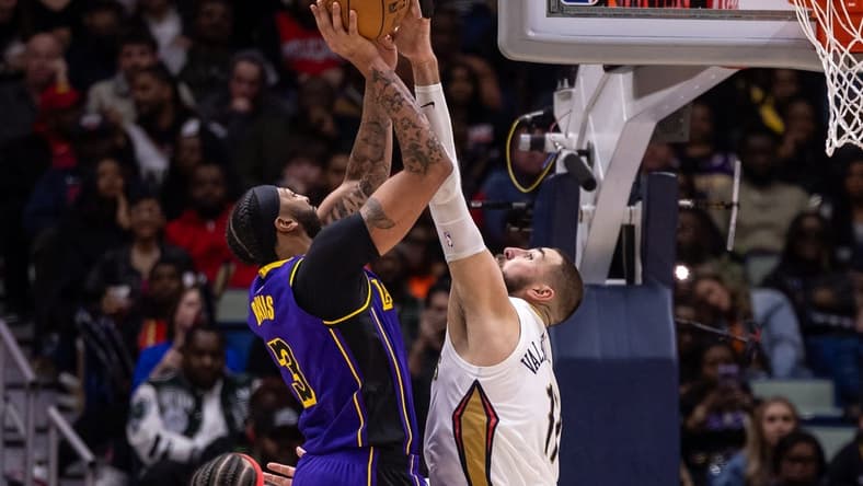 Dec 31, 2023; New Orleans, Louisiana, USA; New Orleans Pelicans center Jonas Valanciunas (17) blocks the jump shot attempt by Los Angeles Lakers forward Anthony Davis (3) during the second half at Smoothie King Center. Mandatory Credit: Stephen Lew-USA TODAY Sports
