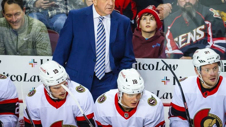 Jan 9, 2024; Calgary, Alberta, CAN; Ottawa Senators head coach Jacques Martin on his bench against the Calgary Flames during the first period at Scotiabank Saddledome. Mandatory Credit: Sergei Belski-USA TODAY Sports