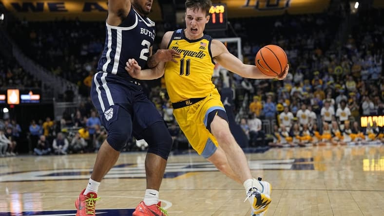 Jan 10, 2024; Milwaukee, Wisconsin, USA; Marquette Golden Eagles guard Tyler Kolek (11) drives for the basket against Butler Bulldogs guard Pierre Brooks (21) during the second half at Fiserv Forum. Mandatory Credit: Jeff Hanisch-USA TODAY Sports