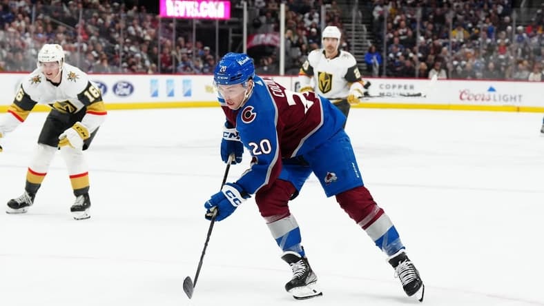 Jan 10, 2024; Denver, Colorado, USA; Colorado Avalanche center Ross Colton (20) controls the puck in the second period against the Vegas Golden Knights at Ball Arena. Mandatory Credit: Ron Chenoy-USA TODAY Sports