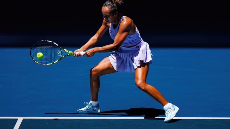 Jan 14, 2024; Melbourne, Victoria, Australia; Leylah Fernandez of Canada hits a shot against Sarah Bejlek of the Czech Republic in the first round of the women s singles. Mandatory Credit: Mike Frey-USA TODAY Sports