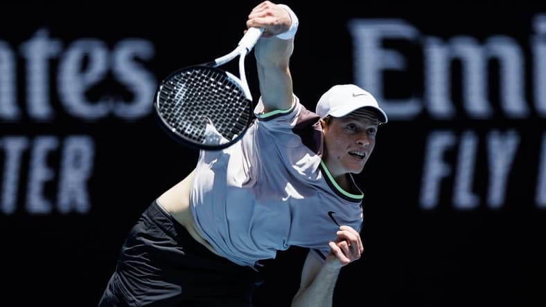 Jan 14, 2024; Melbourne, Victoria, Australia; Jannik Sinner of Italy hits a shot against Botic Van De Zandschulp of the Netherlands in the first round of the men s singles. Mandatory Credit: Mike Frey-USA TODAY Sports