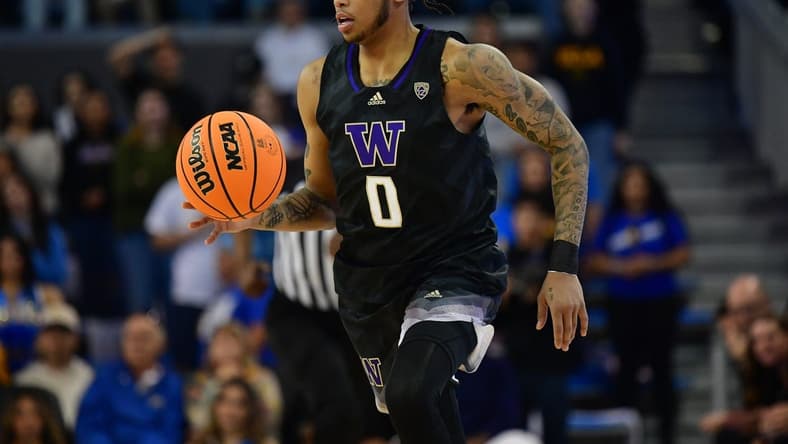 January 14, 2024; Los Angeles, California, USA; Washington Huskies guard Koren Johnson (0) brings the ball up court against the UCLA Bruins during the first half at Pauley Pavilion. Mandatory Credit: Gary A. Vasquez-USA TODAY Sports