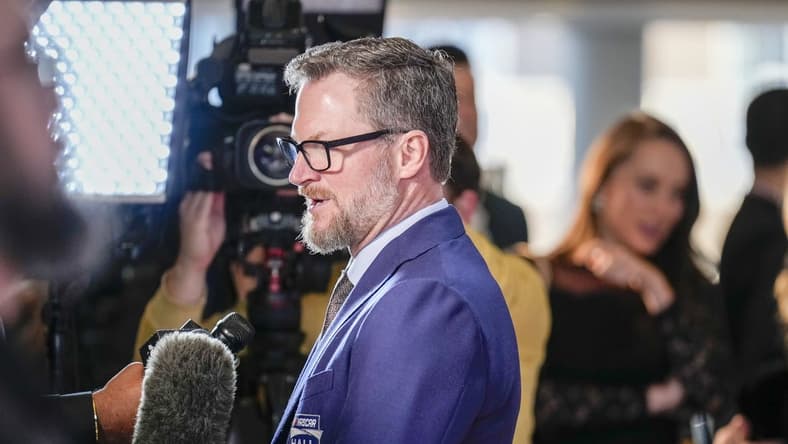 Jan 19, 2024; Charlotte, NC, USA; Dale Earnhardt Jr. talks to interviewers during the red carpet at Charlotte Convention Center Crown Ballroom. Mandatory Credit: Jim Dedmon-USA TODAY Sports