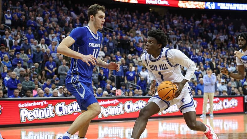 Jan 20, 2024; Newark, New Jersey, USA; Seton Hall Pirates guard Kadary Richmond (1) drives to the basket against Creighton Bluejays center Ryan Kalkbrenner (11) during double overtime at Prudential Center. Mandatory Credit: Vincent Carchietta-USA TODAY Sports