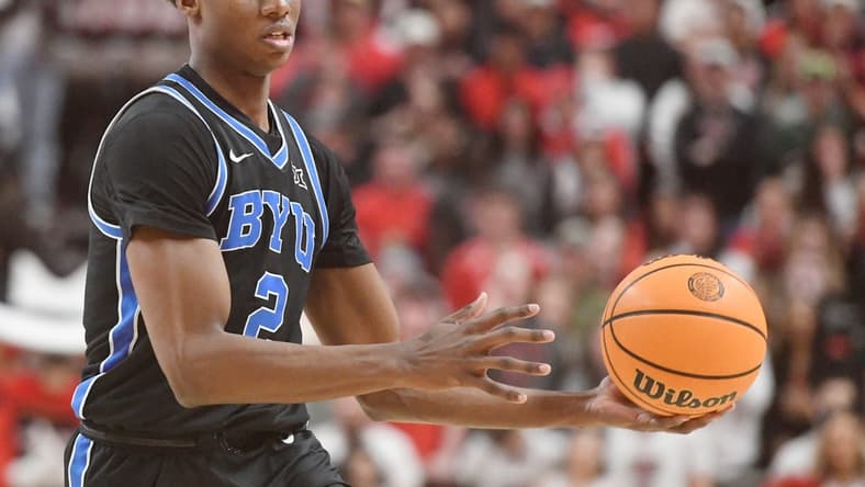 BYU's guard Jaxson Robinson (2) passes the ball against Texas Tech in a Big 12 basketball game, Saturday, Jan. 20, 2024, at United Supermarkets Arena.