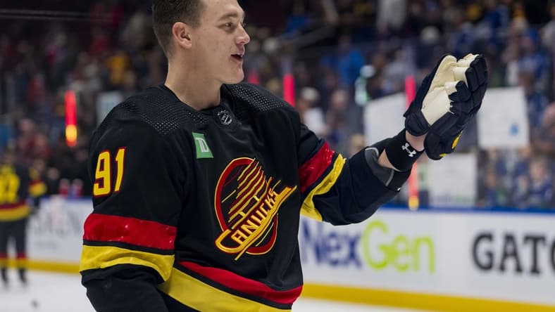 Jan 22, 2024; Vancouver, British Columbia, CAN; Vancouver Canucks defenseman Nikita Zadorov (91) waves to the fans during warm up prior to a game against the Chicago Blackhawks at Rogers Arena. Mandatory Credit: Bob Frid-USA TODAY Sports