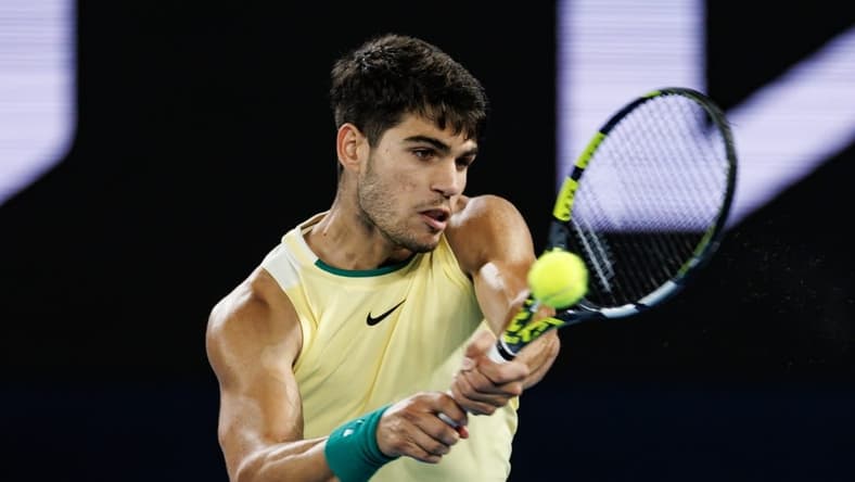Jan 24, 2024; Melbourne, Victoria, Australia; Carlos Alcaraz of Spain in action against Alexander Zverev of Germany in the quarter final of the men s singles at the Australian Open. Mandatory Credit: Mike Frey-USA TODAY Sports
