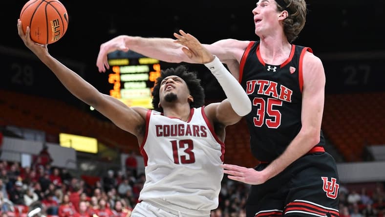 Jan 24, 2024; Pullman, Washington, USA; Washington State Cougars forward Isaac Jones (13) shoots the ball against Utah Utes center Branden Carlson (35) in the second half at Friel Court at Beasley Coliseum. Washington State won 79-57. Mandatory Credit: James Snook-USA TODAY Sports