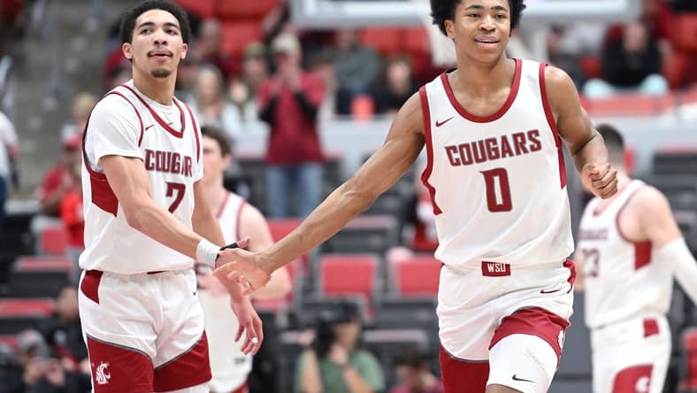 Jan 24, 2024; Pullman, Washington, USA; Washington State Cougars forward Jaylen Wells (0) celebrates a three-pointer during a game against the Utah Utes in the second half at Friel Court at Beasley Coliseum. Washington State won 79-57. Mandatory Credit: James Snook-USA TODAY Sports