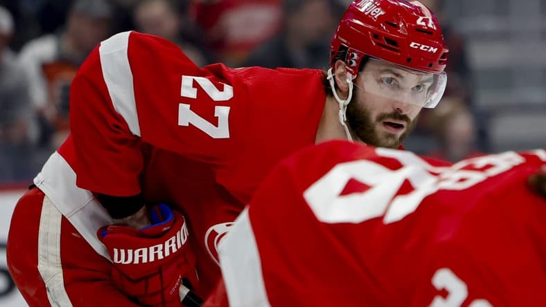 Jan 25, 2024; Detroit, Michigan, USA;  Detroit Red Wings center Michael Rasmussen (27) gets set during a face off in the first period against the Philadelphia Flyers at Little Caesars Arena. Mandatory Credit: Rick Osentoski-USA TODAY Sports