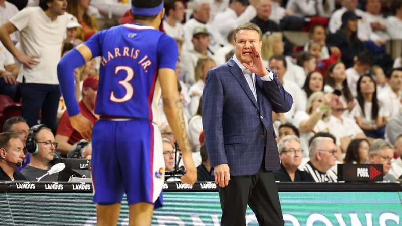 Feb 4, 2023; Ames, Iowa, USA;  Kansas Jayhawks head coach Bill Self talks with guard Dajuan Harris Jr. (3) during a game against the Iowa State Cyclones at James H. Hilton Coliseum. Mandatory Credit: Reese Strickland-USA TODAY Sports