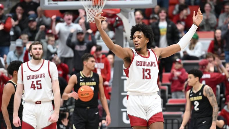 Jan 27, 2024; Pullman, Washington, USA; Washington State Cougars forward Isaac Jones (13) celebrates after a play against the Colorado Buffaloes in the second half at Friel Court at Beasley Coliseum. Washington State won 78-69. Mandatory Credit: James Snook-USA TODAY Sports