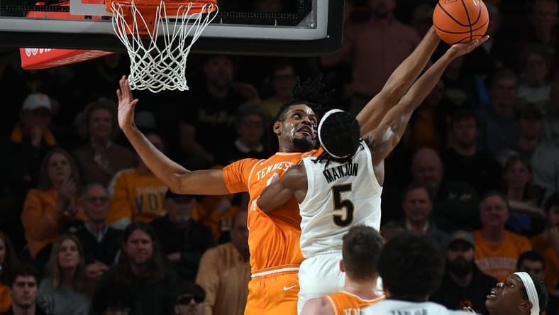Jan 27, 2024; Nashville, Tennessee, USA; Tennessee Volunteers forward Jonas Aidoo (0) blocks a shot attempt by Vanderbilt Commodores guard Ezra Manjon (5) during the second half at Memorial Gymnasium. Mandatory Credit: Christopher Hanewinckel-USA TODAY Sports